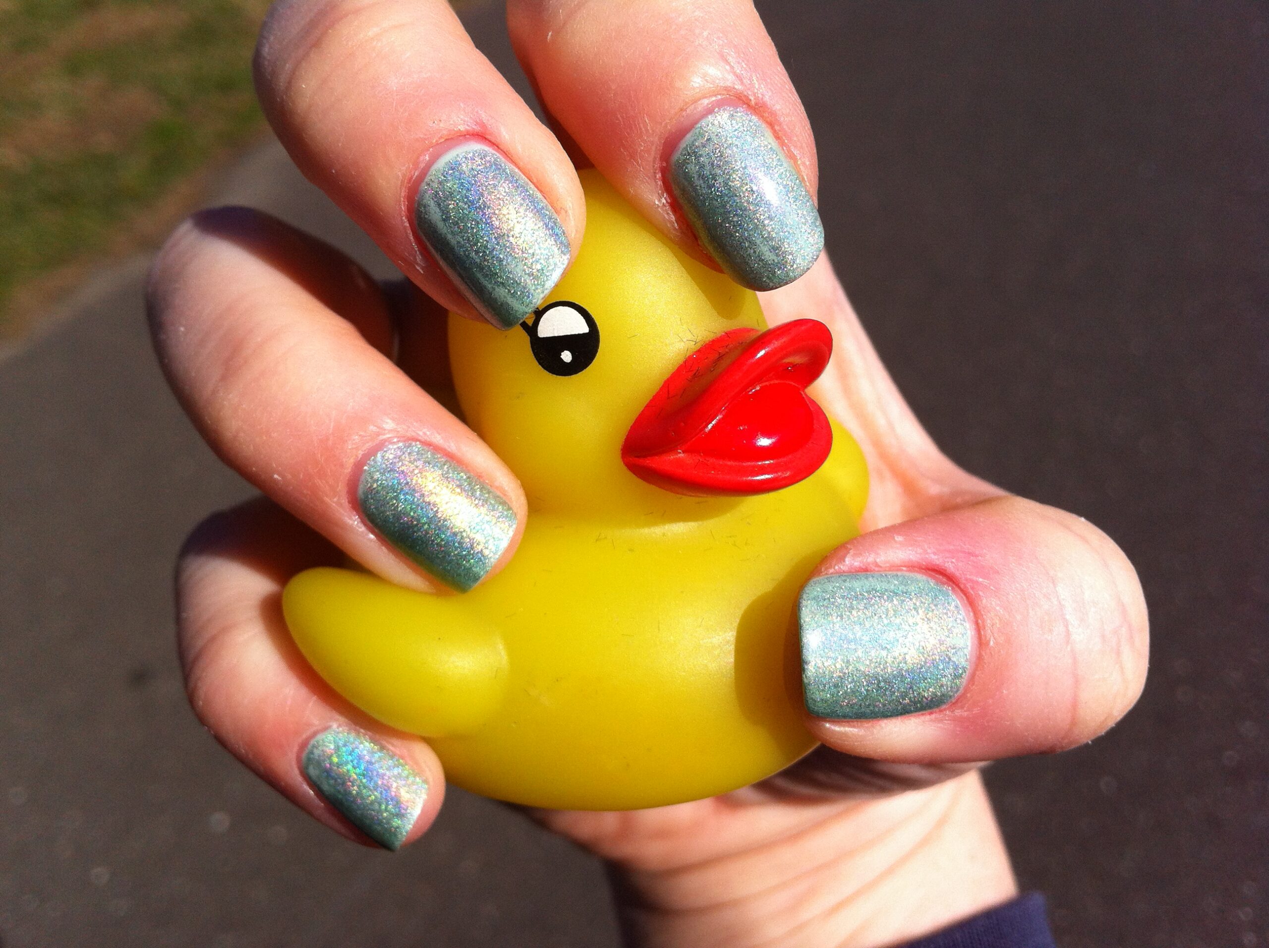 Real human hand and a rubber duckie